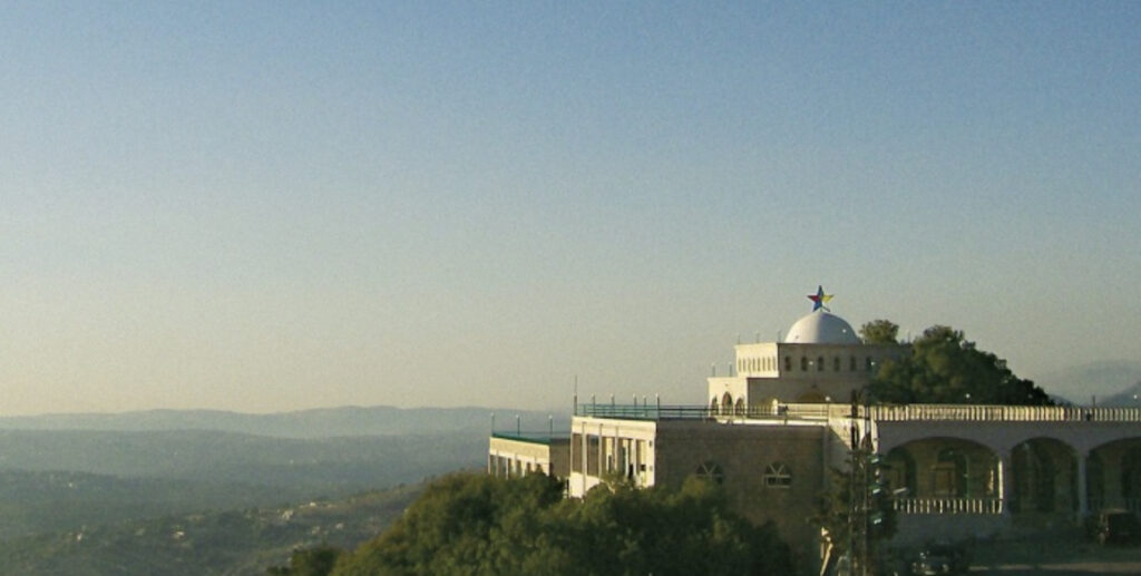 A Druze mosque, sitting on the top of a hill overlooking a valley